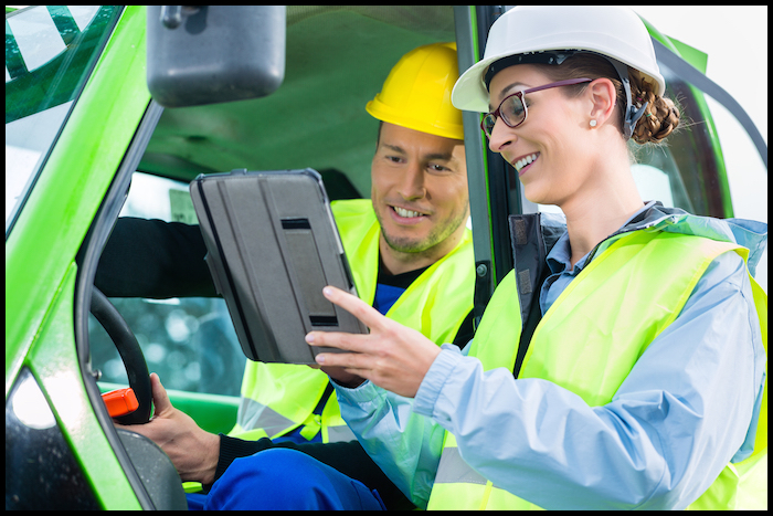 Operators conferring with learning center on tablet